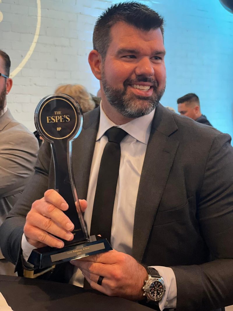 Nick Good holding The ESPE's industry award